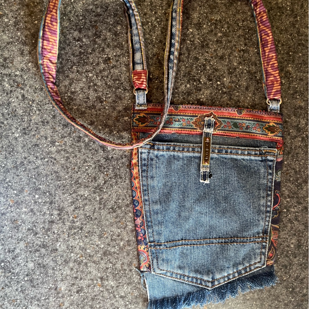 Hand crafted pocket bag. 8 inches wide and 10 inches long. Snap closure.